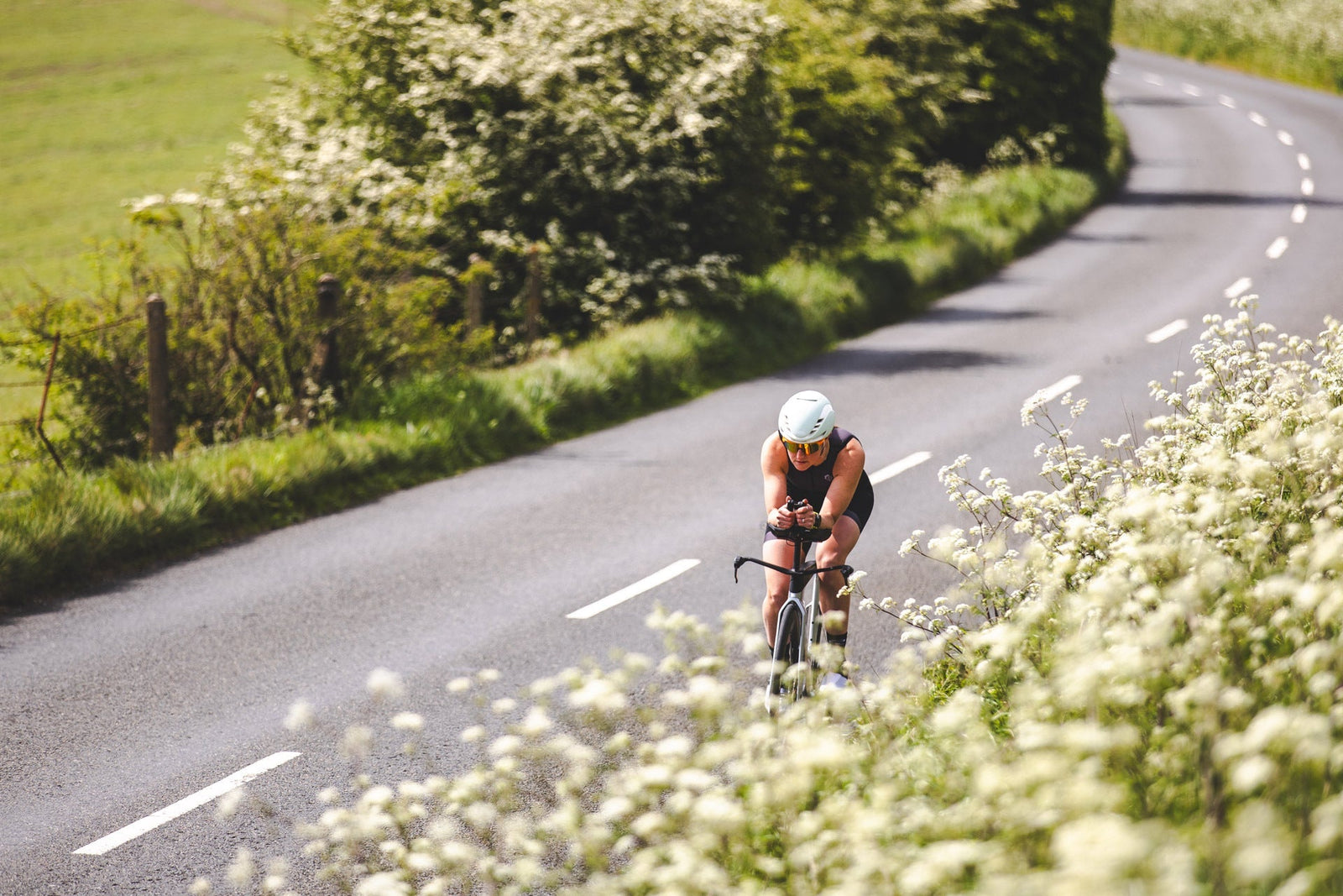 Male triathlete adjusting the sleeve of his tri suit during training, highlighting the importance of comfort and fit in endurance racing.